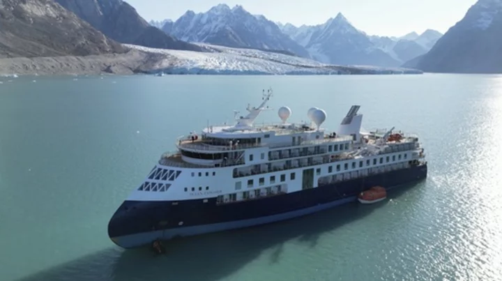 Stranded luxury cruise ship MV Ocean Explorer is pulled free at high tide in Greenland