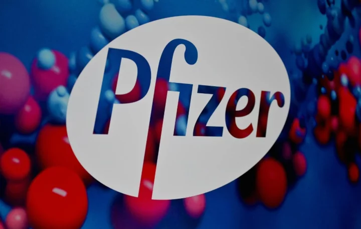 Pfizer reports loss as Covid-19 revenues shrink